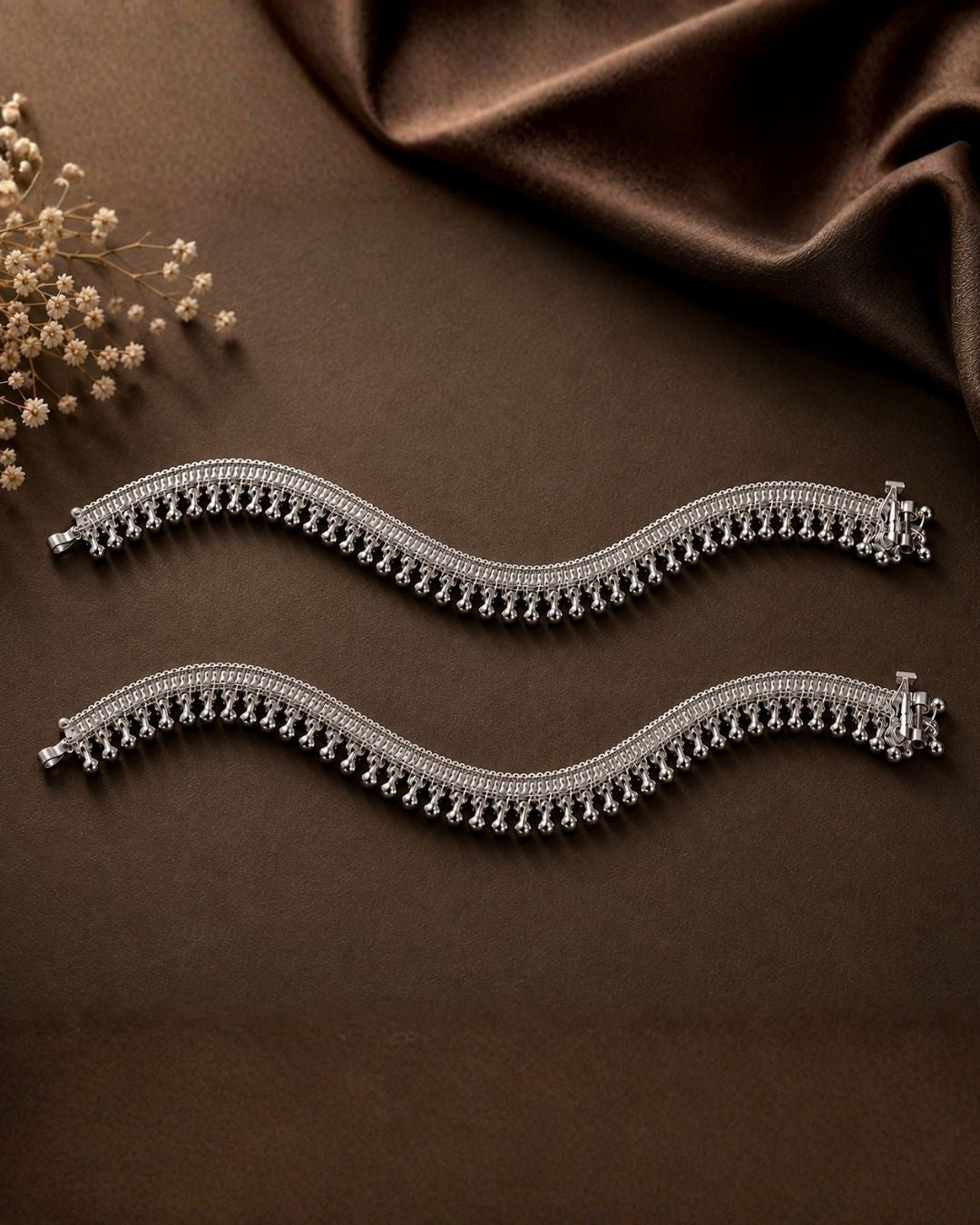Beautiful silver plated designer payal set featuring intricate layered chain detailing and numerous delicate hanging silver beads. Perfect for traditional occasions, festive wear, daily wear, and gifting.