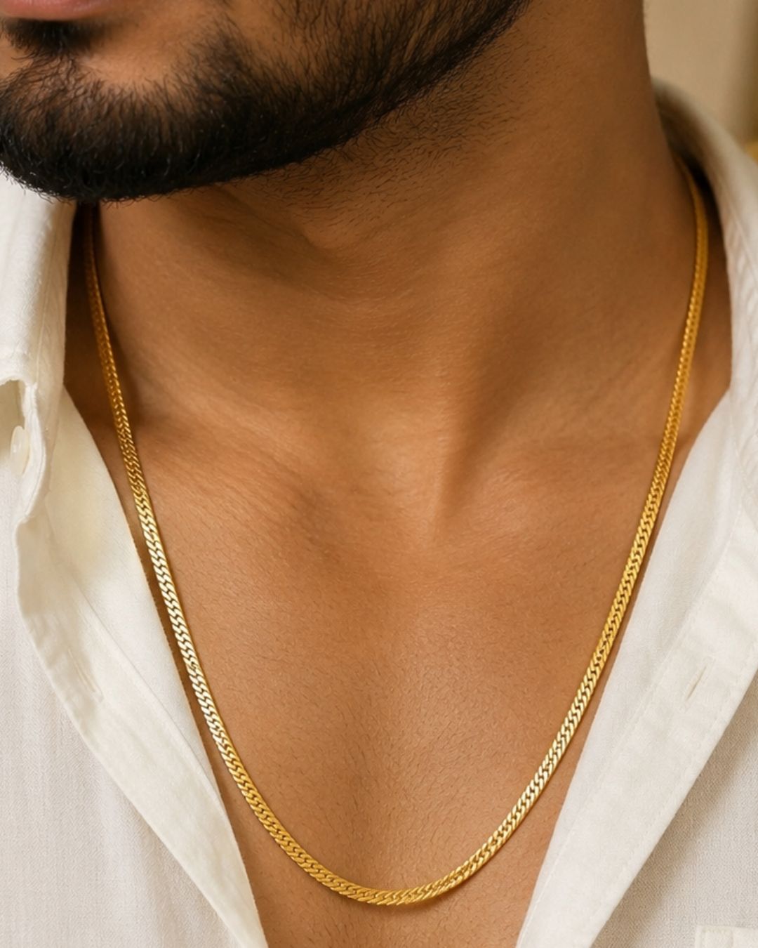 Premium men’s gold plated herringbone chain displayed across a hand, showcasing its sleek flat-link pattern, smooth finish, and elegant golden shine. Suitable for everyday wear, casual outfits, festive occasions, and gifting.