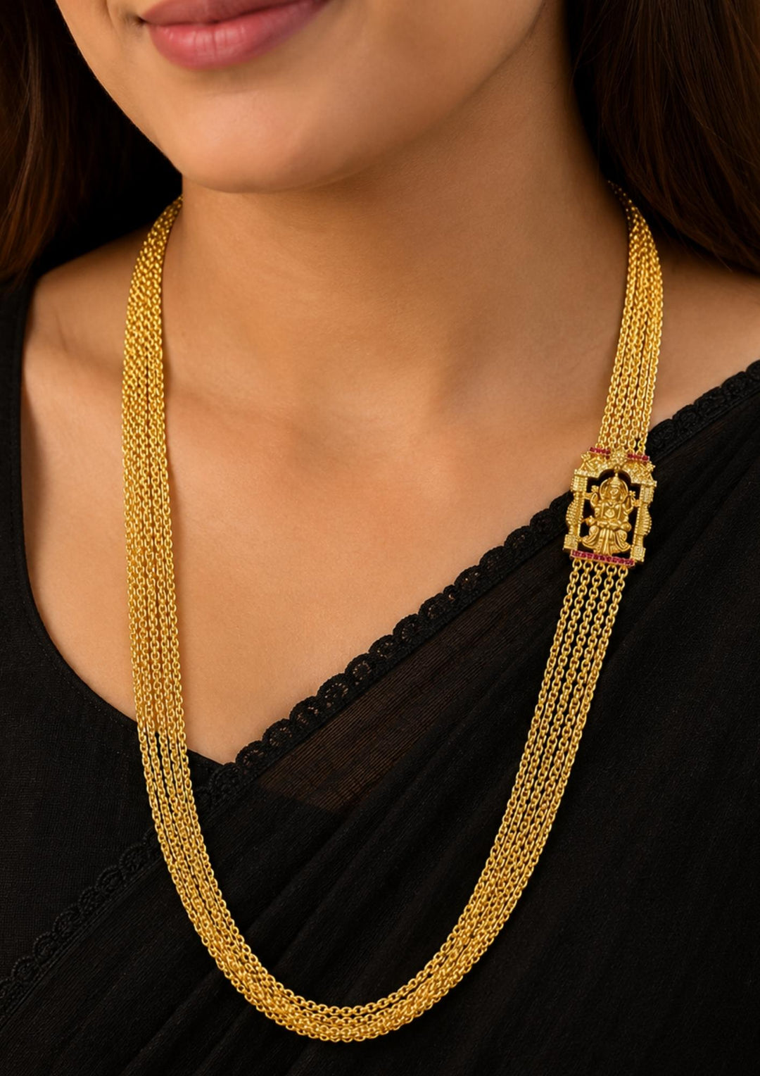 South Indian women wearing Traditional Lakshmi Chandraharam necklace designed with multiple fine gold plated chains and an intricate Goddess Lakshmi centerpiece. A timeless South Indian jewellery piece that complements silk sarees, bridal attire, and festive ethnic wear.
