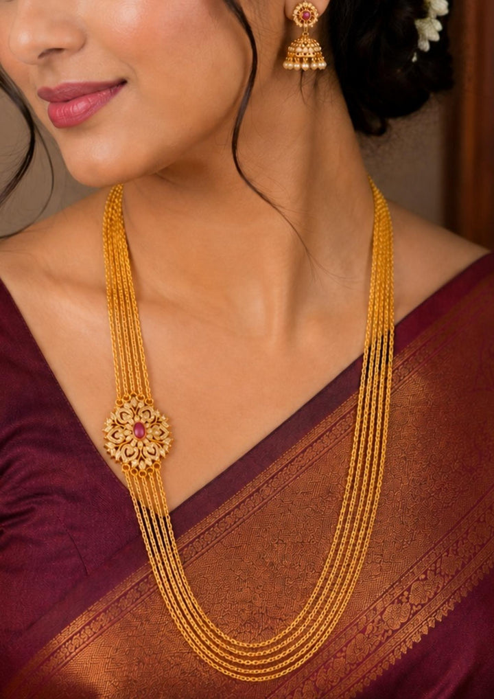 South Indian Women wearing Traditional multi-layer Chandraharam necklace designed with delicate gold plated chains and an intricate floral side motif. An elegant ethnic jewellery piece ideal for silk sarees, temple occasions, festivals, and bridal styling.