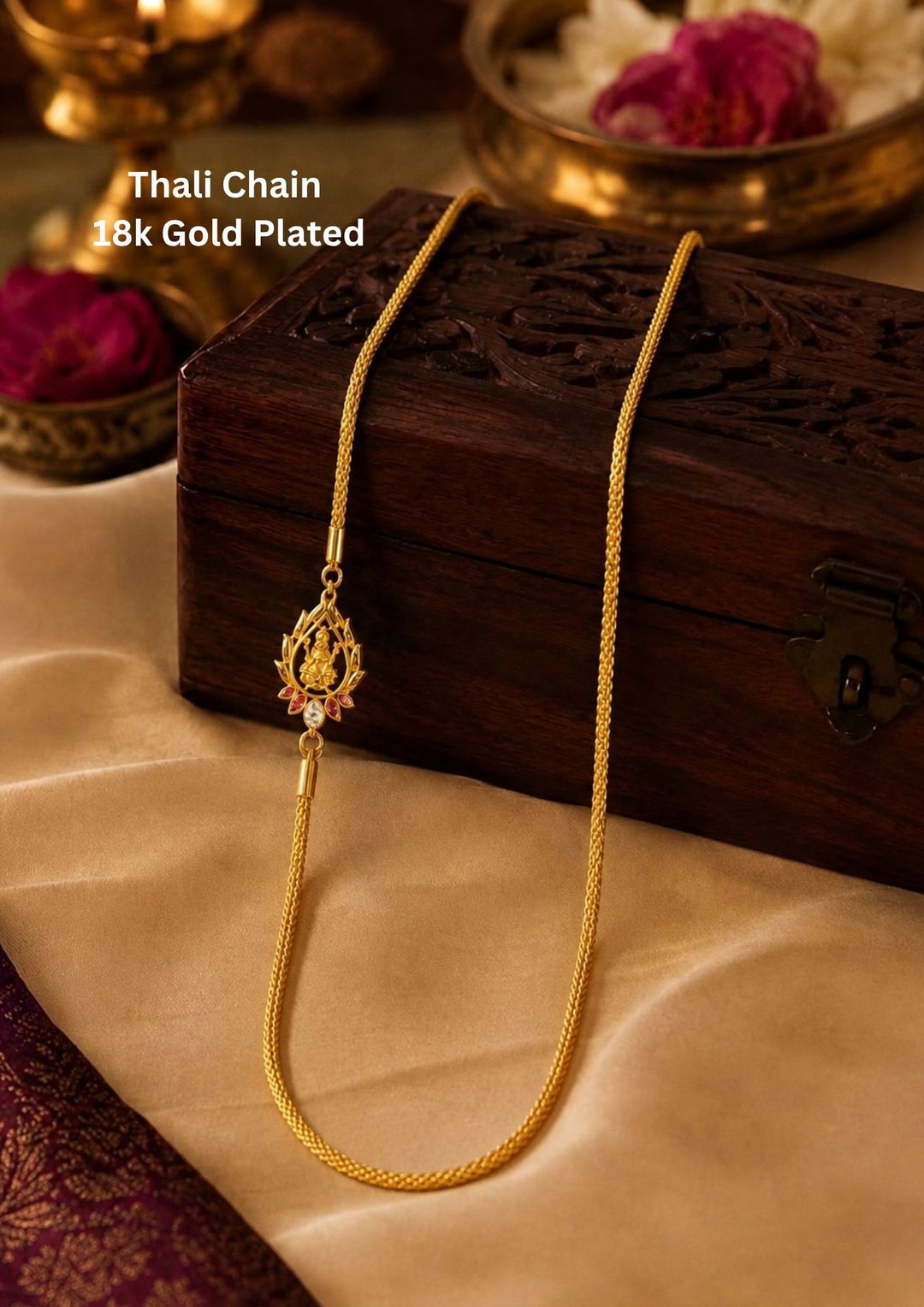 gold plated thali chain featuring a beautifully crafted central Goddess Lakshmi mogappu side pendant embellished with sparkling white zircon stones and ruby pink gemstone accents. This high-quality classic woven chain design mimics a premium gold wedding chain, providing a rich and traditional appearance suitable for weddings, festivals, poojas, daily wear, family functions, traditional sarees, and ethnic outfits with skin-friendly quality, anti-fade long-lasting polish, comfortable weight