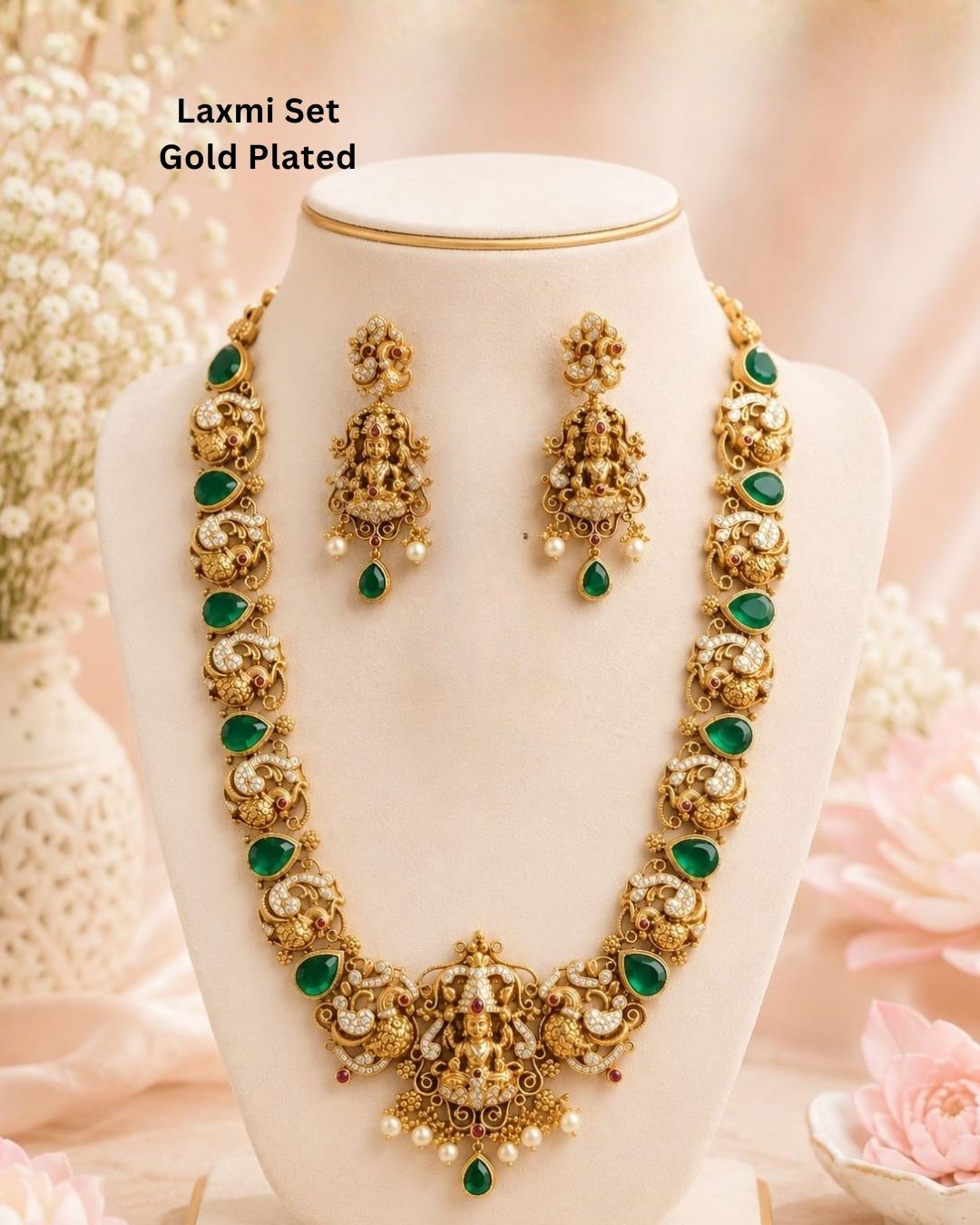 Premium antique gold plated temple necklace and earrings set crafted with intricate Ganesha and peacock designs, sparkling CZ stones, green accents, and elegant pearl details.