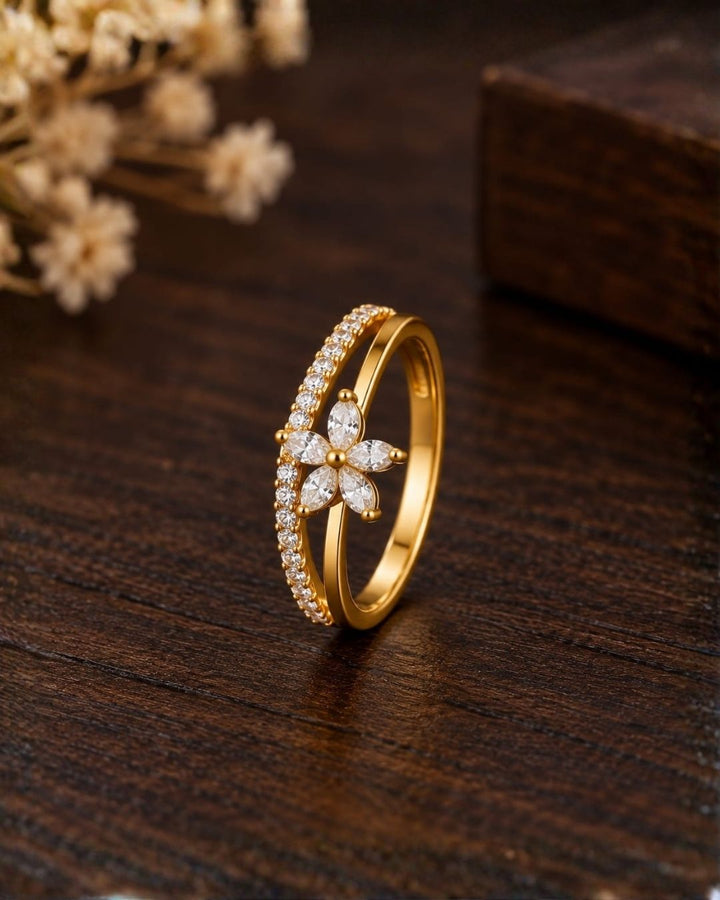 Stylish gold plated adjustable ring with a sparkling floral centerpiece and crystal-studded band, perfect for everyday and occasion wear.