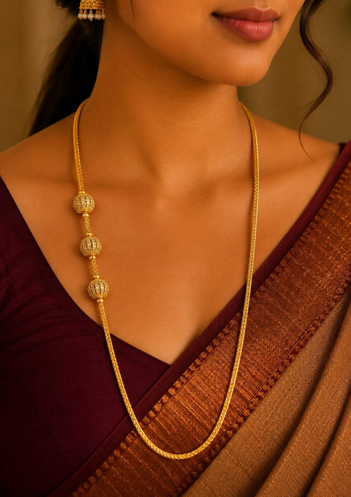 South Indian Women wearing Elegant 18k gold plated thalli chain adorned with sparkling zircon ball bead accents with a premium woven chain design perfect for festive and everyday traditional wear.