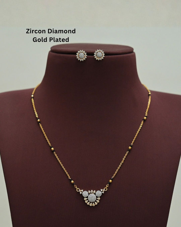 Stylish gold plated necklace set featuring a delicate black beaded chain, sparkling zircon diamond floral pendant, and matching sun-inspired stud earrings, perfect for everyday and festive wear.