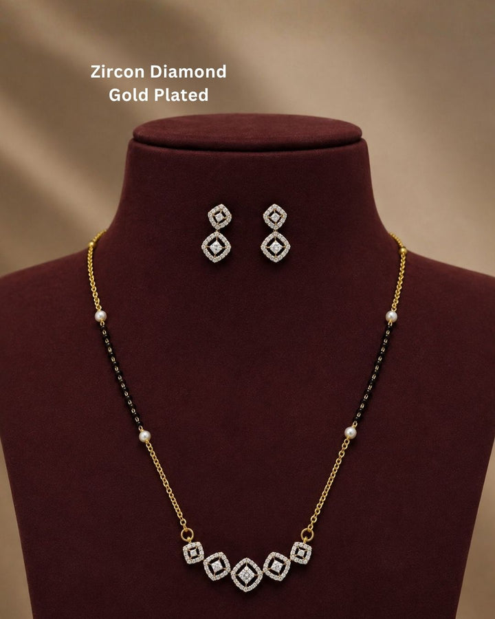 Beautiful black beads gold plated necklace set featuring a delicate chain, pearl accents, sparkling geometric pendant, and matching earrings. Perfect for daily wear, festive occasions, traditional outfits, and gifting.