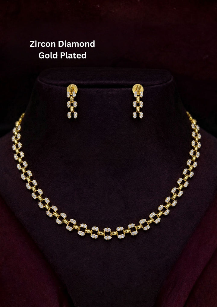 Elegant zircon diamond gold plated necklace set featuring a sleek lightweight chain adorned with sparkling oval zircon motifs throughout the design. The matching drop earrings showcase delicate zircon clusters that create a graceful and minimalistic appearance suitable for daily wear, office wear and special occasions
