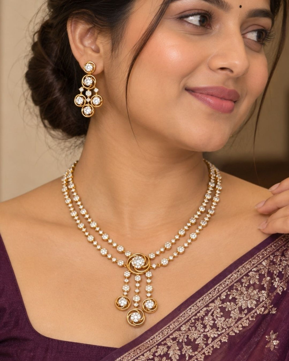 Gold plated two-layer necklace and matching hanging earrings set featuring two lines of small, round white stones. The chains join at a central round flower motif, from which three delicate lines of white stones hang down, each ending in a small circle design. The set features a clean layout suitable for festivals, family parties, and traditional celebrations.