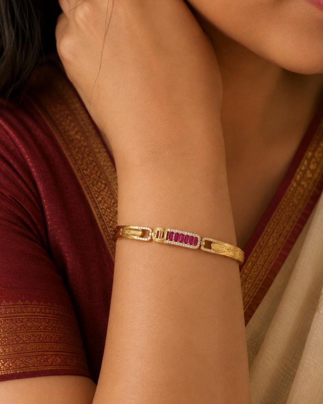 Elegant gold plated men's bracelet featuring engraved leaf-pattern panels connected with sparkling stone links and a central row of red rectangular stones. Perfect for daily wear, festive occasions, parties, weddings, and gifting.
