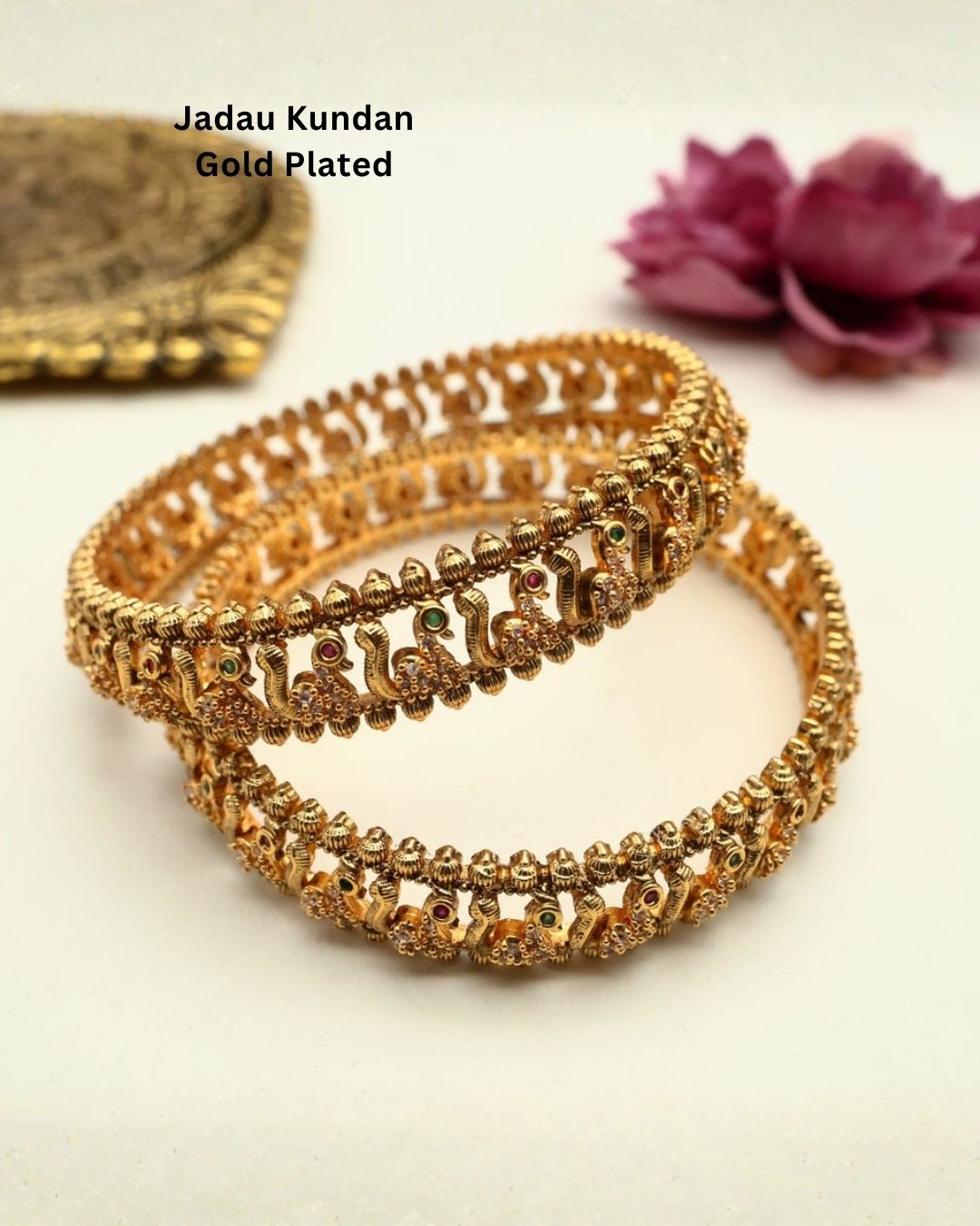 Premium gold plated designer bangles featuring repeating floral zircon motifs with textured gold bead detailing. Perfect for traditional wear, festive occasions, weddings, and gifting.