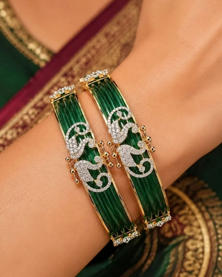 Stylish diamond finish changeable bangles featuring an elegant peacock design with gold detailing and sparkling stone accents. Perfect for traditional outfits, festive occasions, weddings, and daily ethnic wear.