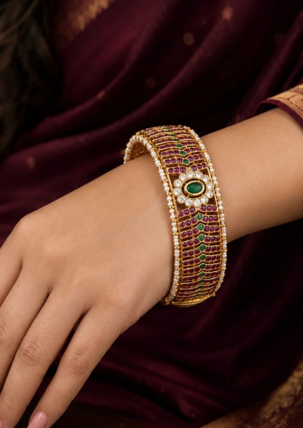 South indian women's Beautiful Jadau Kundan gold plated openable kada adorned with ruby, green stones, sparkling Kundan work, and pearl borders. Perfect for weddings, festive occasions, traditional wear, and premium gifting.