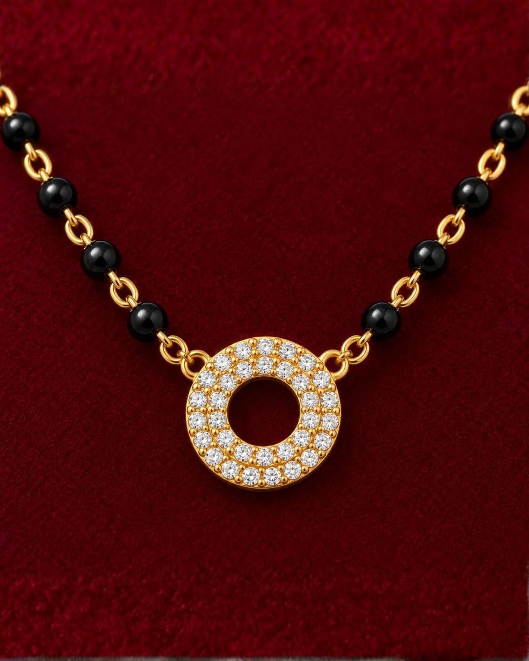 South indian Women wearing Gold plated black bead mangalsutra with a circular stone pendant displayed on a beige surface with a minimal decorative background.
