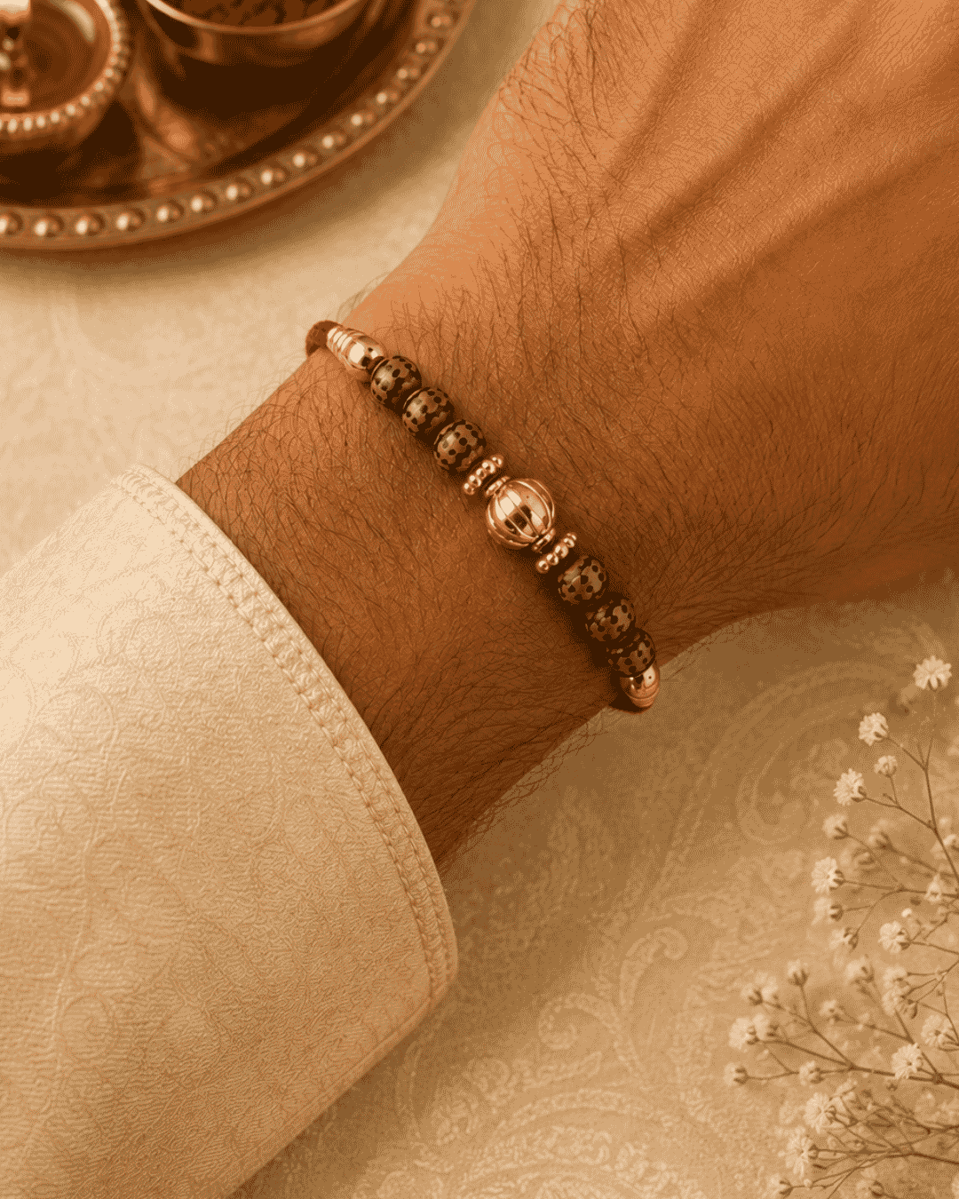 Beautiful designer beads gold plated Rakhi featuring textured beads, gold accents, and a classic handcrafted design. Perfect for Raksha Bandhan celebrations and thoughtful gifting.