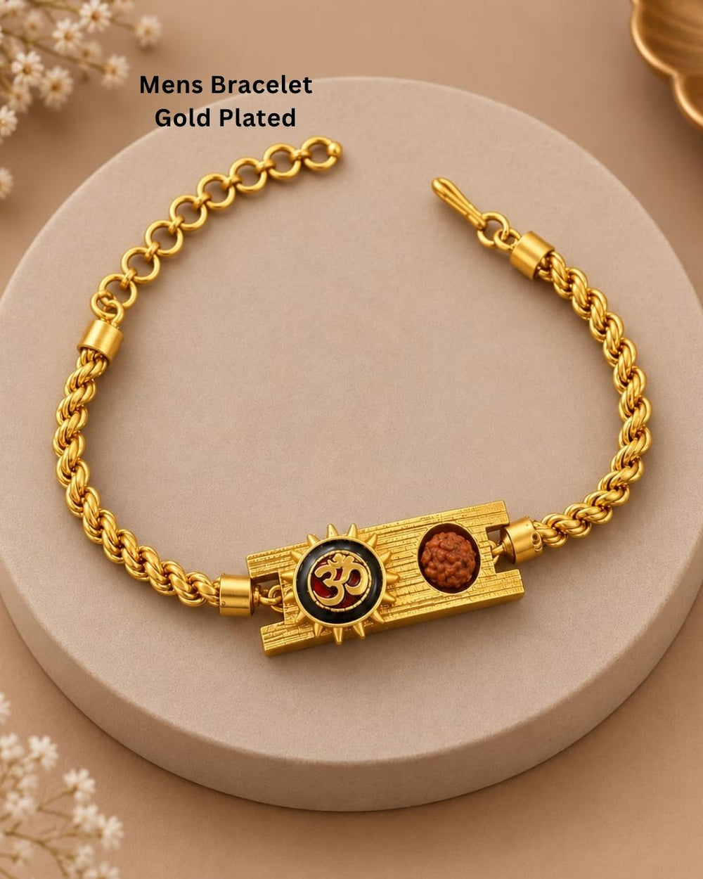 Elegant gold plated men’s bracelet featuring a prominent Om symbol, Rudraksha bead, ornate rectangular centerpiece, and braided gold chain, perfect for daily wear, festive occasions, and traditional styling.