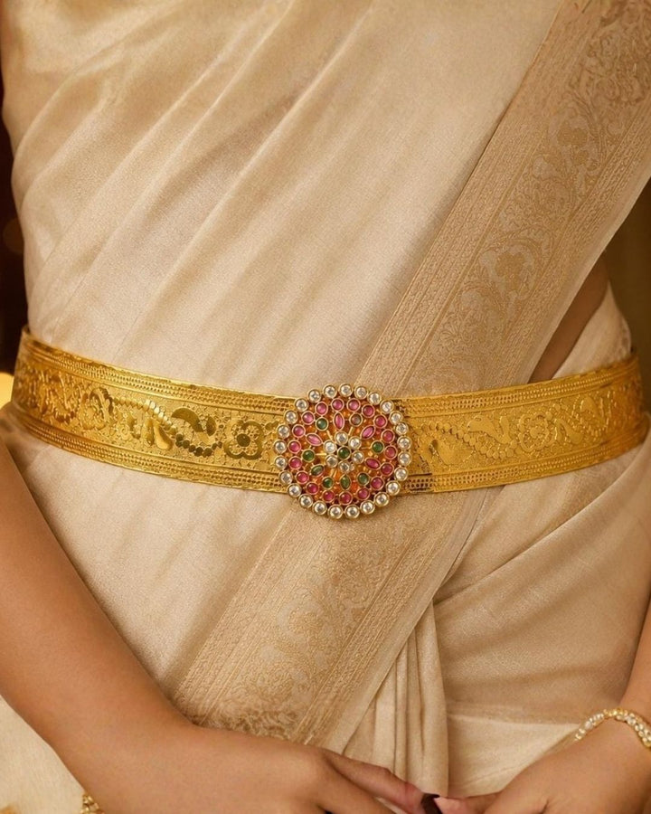 Beautiful gold plated designer hip belt featuring pink, green, and white stone accents with a removable floral pendant. Suitable for kids and adults, perfect for traditional outfits, festive occasions, dance performances, weddings, and special events.