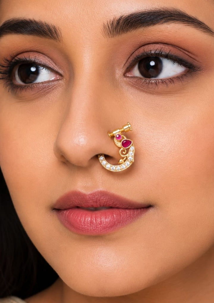 Close-up of a south indian woman wearing traditional nose pin Gold-plated nose pin with gemstones show very clearly how it look and nose pins are indian traditions to women can be used for weeding&