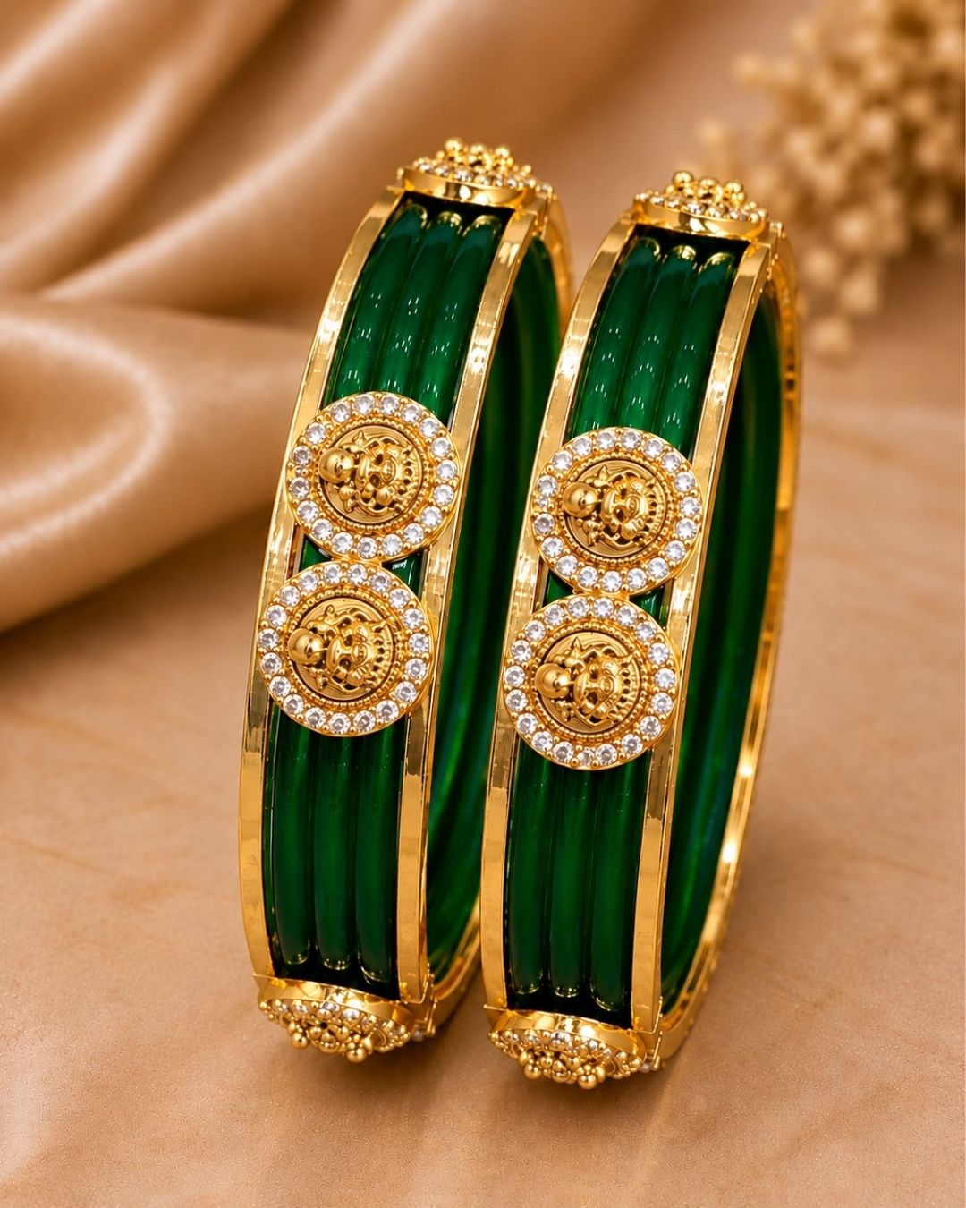 Traditional gold plated interchangeable bangles featuring rich red detailing, polished gold borders, circular motifs embellished with sparkling white stones, and decorative bead accents, perfect for festive, wedding, and traditional occasions.
