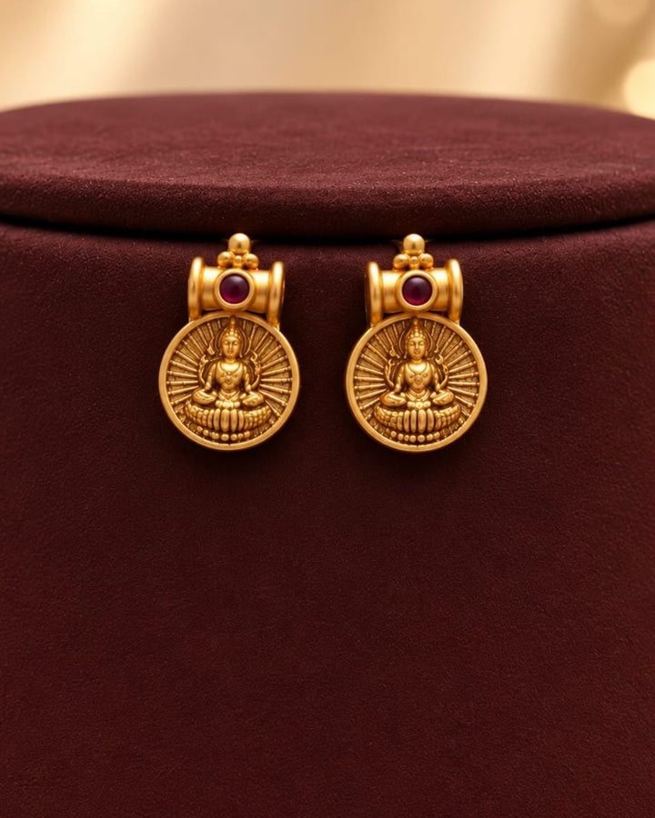 Antique gold plated South Indian coin necklace set with Goddess Lakshmi motifs and matching earrings for festive and traditional wear.