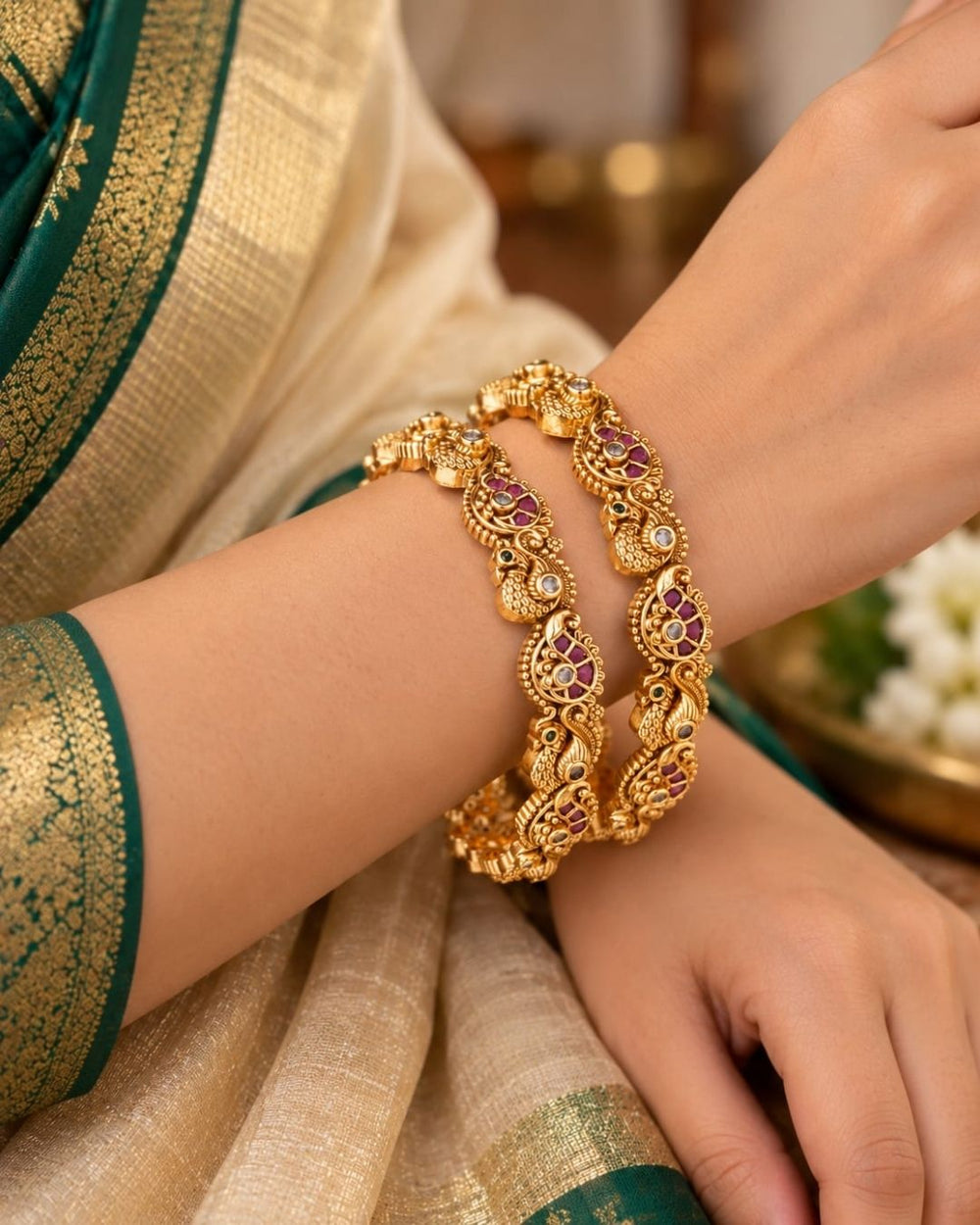 Jadau kundan gold plated bangles featuring intricate peacock motifs, purple and green stone accents, and antique gold detailing.