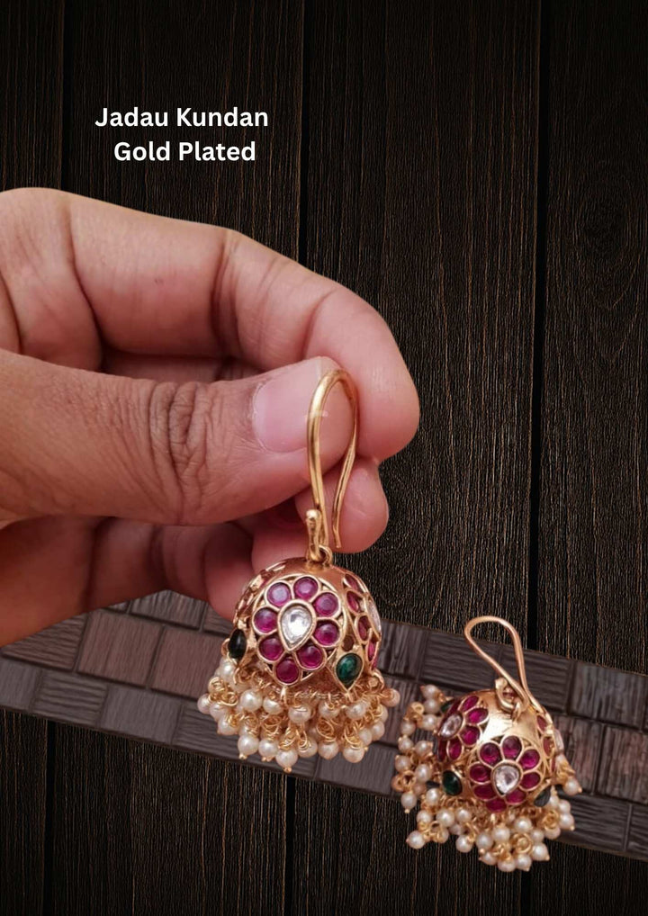 Gold Plated Traditional Jhumkas designed in dome-shaped jhumka with  red and green stone with beads looks very clear and hook hangings, lightweight, sweat proof coating, anti-fade color, and skin-friendly suitable for weddings, festivals, pooja functions, receptions, and dailywera