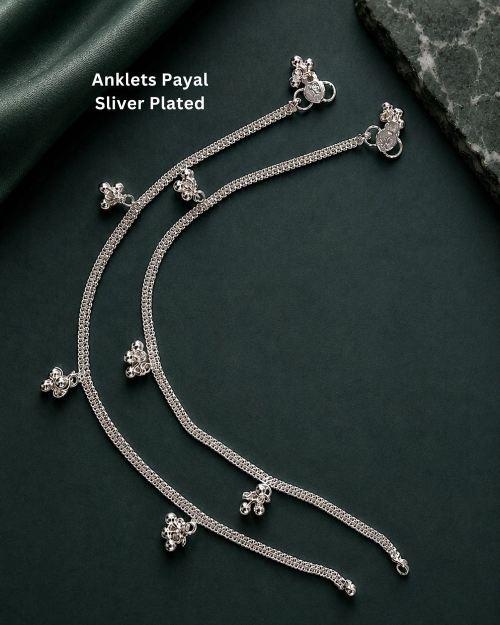 Beautiful silver plated designer anklet set featuring fine chain detailing and delicate floral hanging charms. Perfect for traditional occasions, festive wear, daily wear, and gifting.
