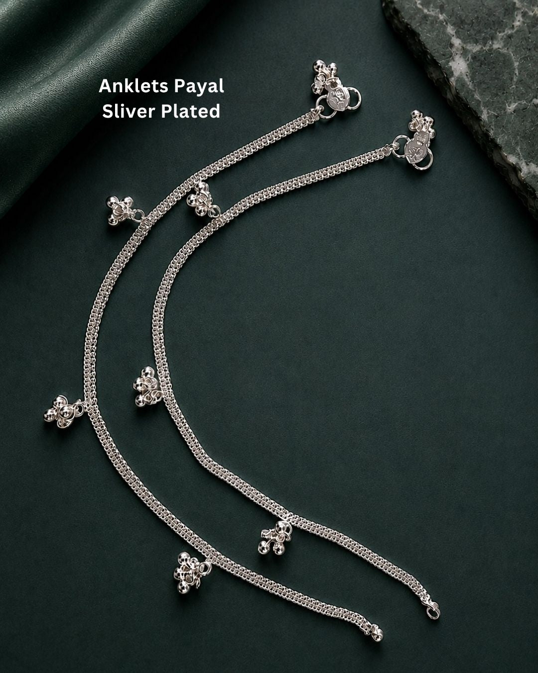 Beautiful silver plated designer anklet set featuring fine chain detailing and delicate floral hanging charms. Perfect for traditional occasions, festive wear, daily wear, and gifting.