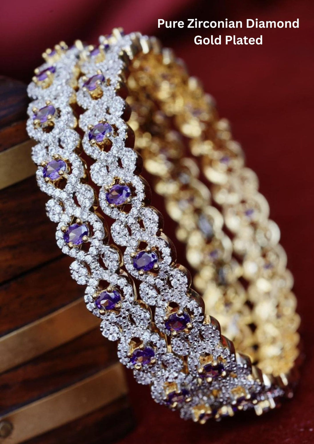 Two gold-plated zirconia bangles with purple stones
