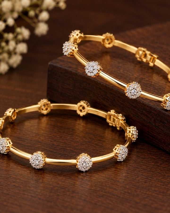 gold plated flower bangles come with zircon diamond and in picture shows clearly how it looks looks very classy and simple and ani faded and skin safe and can be used for daily ware, office ware and festivals