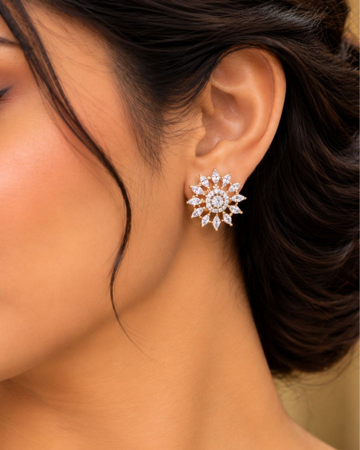Premium gold plated necklace set featuring a large floral-inspired zircon pendant surrounded by sparkling stones, paired with matching floral stud earrings. Perfect for weddings, festive occasions, parties, traditional wear, and gifting.