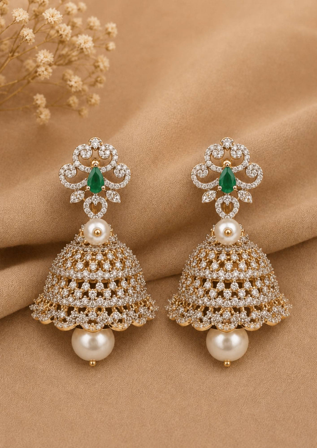 zircon diamond gold plated 4 in 1 green jhumkas and can be used like 4 ways and for all the parties cane used this are anti faded and skin safe and can be used for parties , festivals and weeding's 