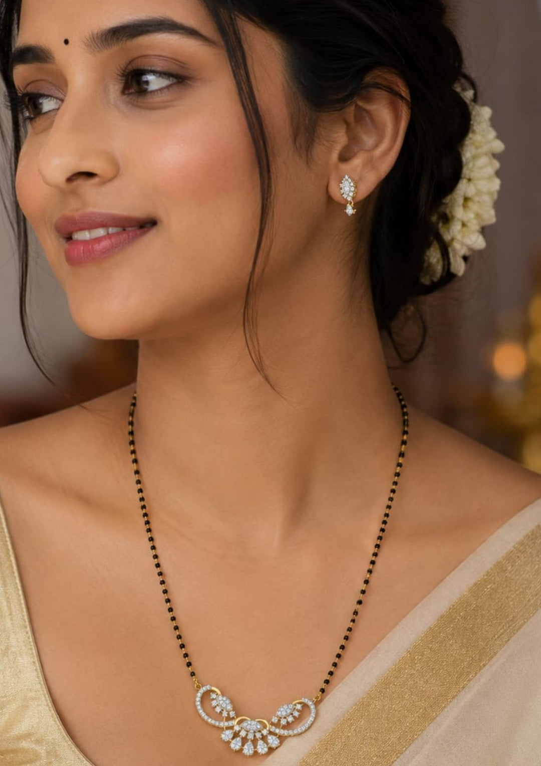 South Indian Woman wearing Gold plated black beads mangalsutra featuring an elegant classic-inspired zircon centerpiece with delicate curved detailing. Lightweight and beautifully crafted for everyday elegance, festive occasions, and gifting.