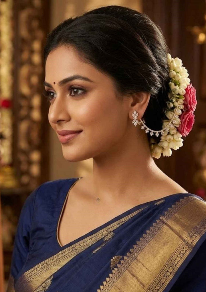 Woman wearing diamond ear chains and looks very traditional and looks vey elegant and can use for weeding's , festival 