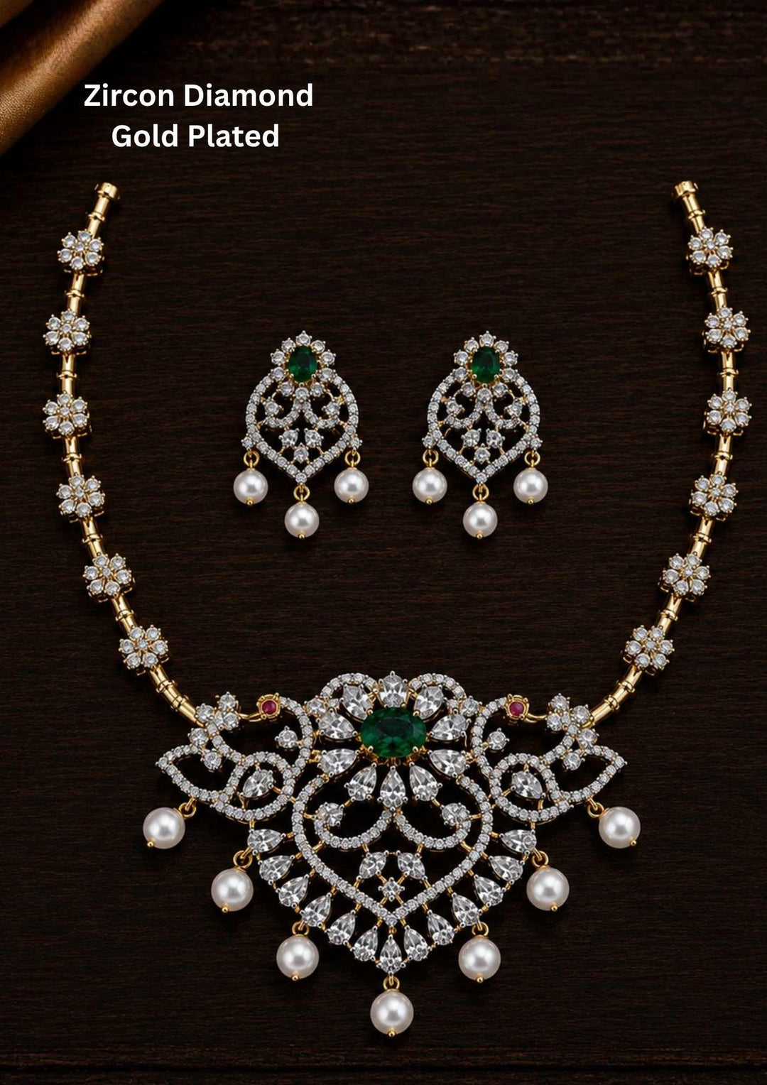 Gold-plated zircon diamond necklace and earrings comes with peacock design and shows in detailed how it look and looks and comes with green gemstone and very classy and neat finishing and can be use for festival , weeding and can gift 