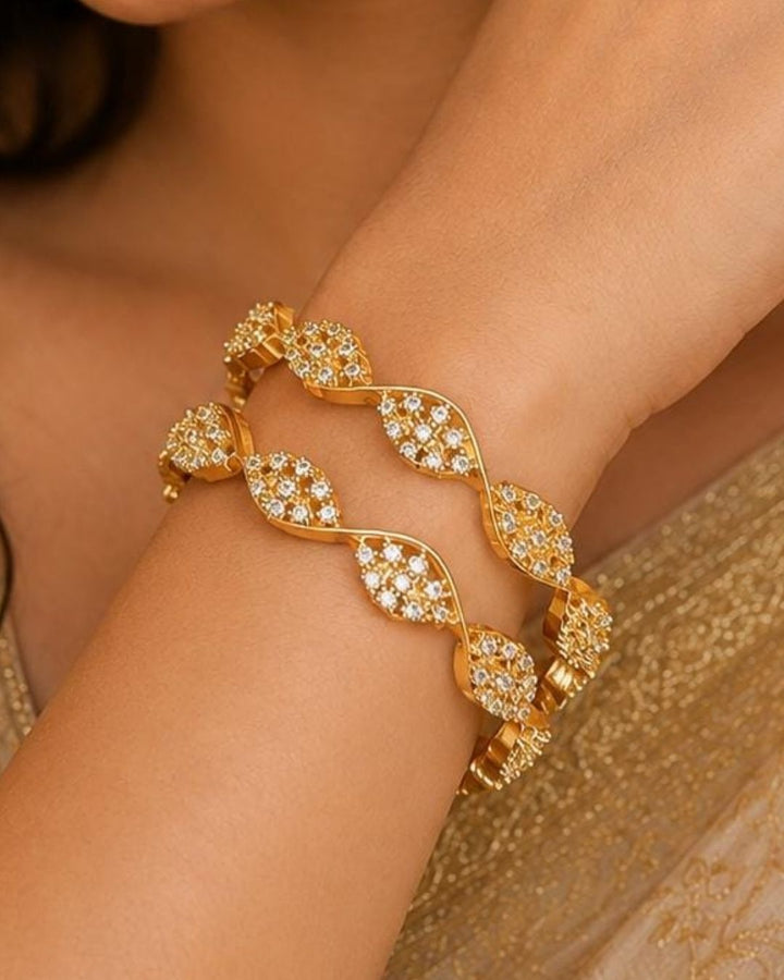 Beautiful zircon diamond gold plated necklace set featuring an elegant repeating leaf pattern, intricate detailing, and sparkling stones. Perfect for festive occasions, parties, traditional wear, and gifting.