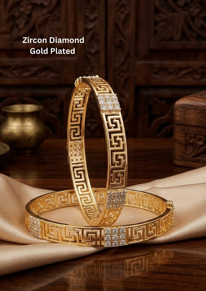 gold plated classic bangles come with zircon diamond and in picture shows clearly how it looks looks very classy and simple and ani faded and skin safe and can be used for daily ware, office ware and festivals