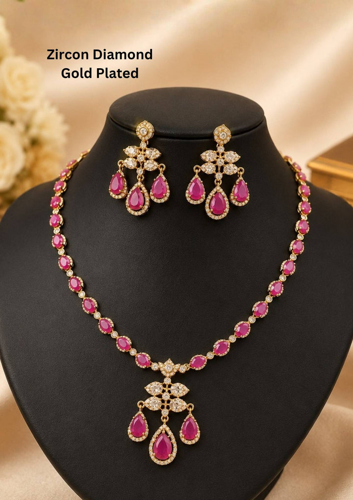 Beautiful zircon diamond gold plated crystal necklace set featuring sparkling teardrop zircon stones and matching chandelier earrings. Lightweight, elegant, and perfect for weddings, receptions, parties, festive celebrations, and gifting.