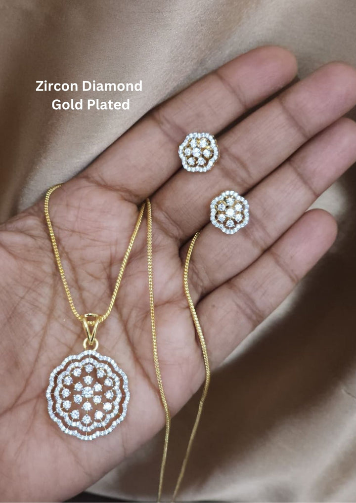 Gold-plated zircon diamond necklace and earrings featuring a slender curb chain with a large, circular openwork floral pendant heavily accented with white zircon diamonds. The set includes a matching pair of smaller, round flower-shaped stud earrings.