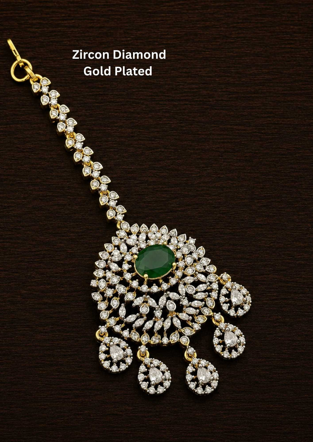 Gold-plated Zircon Diamond Mangtikka (papidi billa) shows in picture clearly how it looks and comes with emerald stone and can be used for weeding's and festivals 