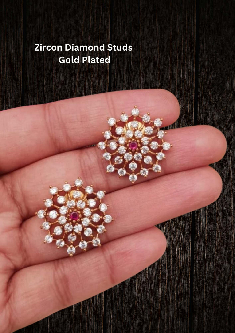 Zircon diamond studs 18K gold plated design with traditional flower design, used green and pink ruby stones and white pearls. These earrings have a gold finish, are lightweight, and comfortable to wear. Perfect for daily wear, pooja, weddings, festivals, functions, and family occasions. They are sweat-proof, anti-fade, skin-friendly, and easy to wear for long hours.