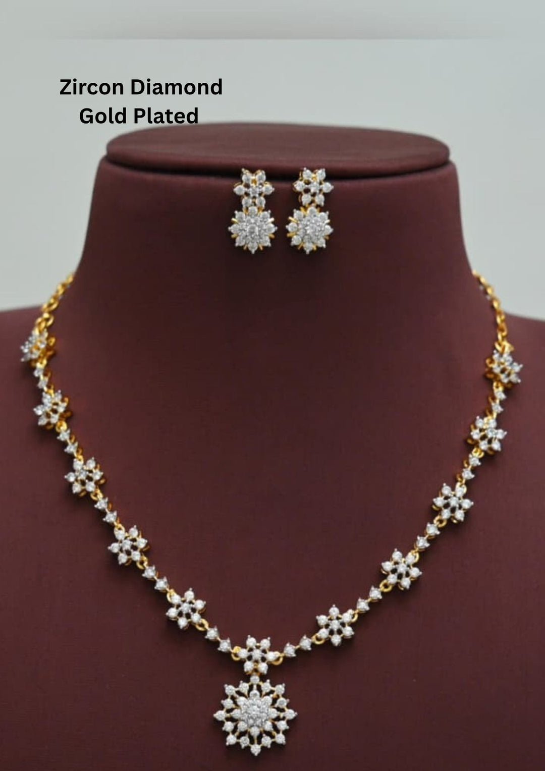 Gold-plated zircon diamond necklace and earrings comes with flower design and shows in detailed how it look and looks very classy and neat finishing and can be use for festival , weeding and can gift 