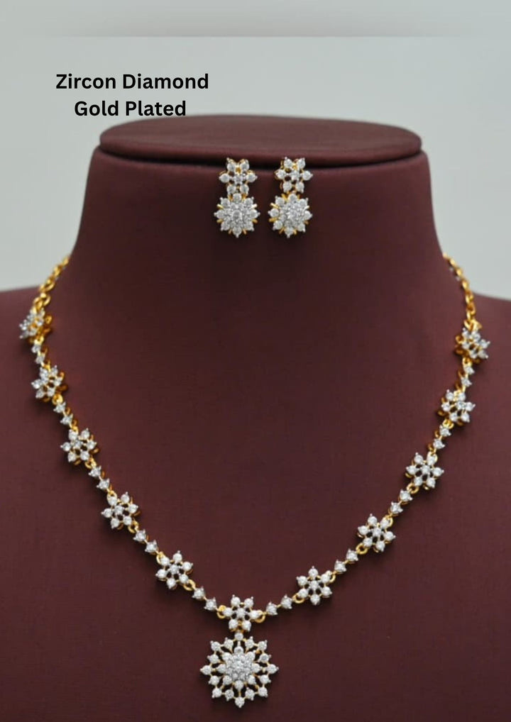 Gold-plated zircon diamond necklace and earrings comes with flower design and shows in detailed how it look and looks very classy and neat finishing and can be use for festival , weeding and can gift 