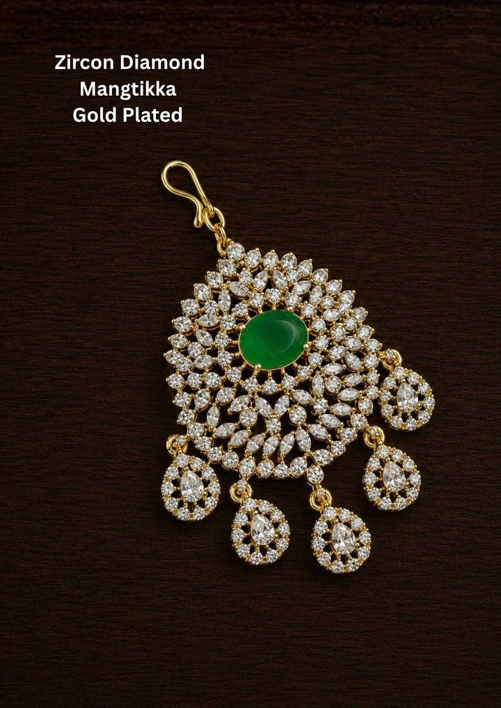 Gold-plated Zircon Diamond Mangtikka (papidi billa) shows in picture clearly how it looks and comers with emerald stone and can be used for weeding's and festivals 