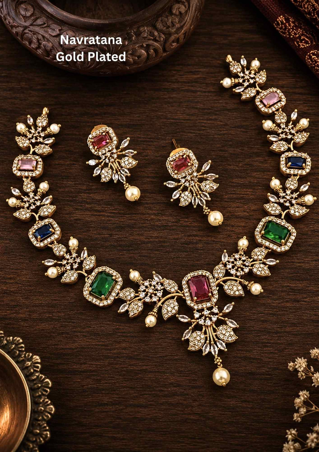 Gold-plated necklace and earrings with Navratana gemstones and comes with zircon diamond and can be used for and with pearl drops can be anti fade and sweat proof