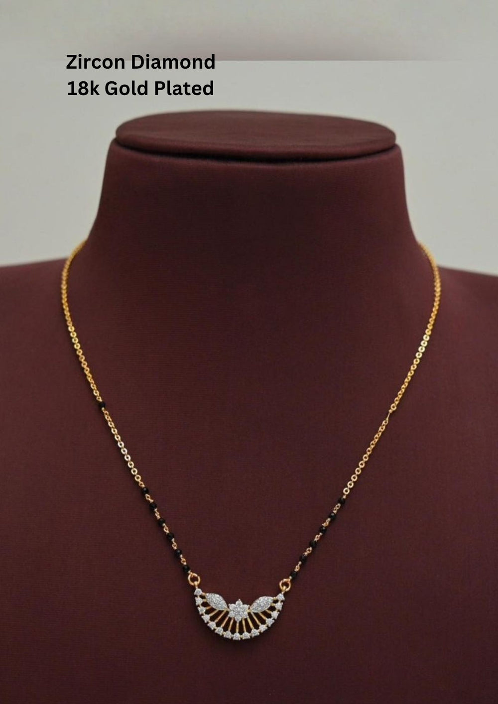 Gold plated black beads mangalsutra featuring an elegant Semi Curve-inspired zircon centerpiece with delicate curved detailing. Lightweight and beautifully crafted for everyday elegance, festive occasions, and gifting.
