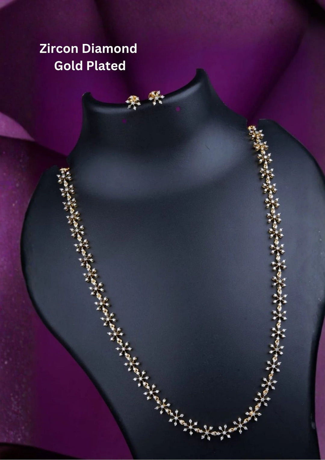Zircon Diamond Gold Plated long chain necklace and matching stud earrings set. The jewelry designed with floral pattern made of sparkling cube zirconia stones on a gold-plated base for festivals, temple visits, weddings, functions and dailywear
