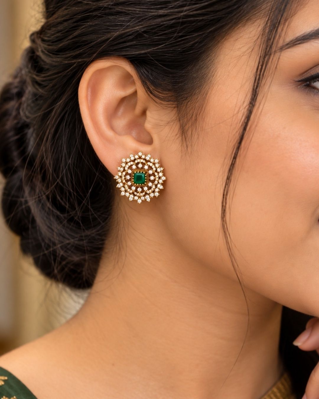 Gold-plated jewelry set with interchangeable stones with purple, pink, green. ornate studs with a gold-toned base. They are heavily embellished with multiple rows of glittering white stones (likely American Diamonds or CZ stones) arranged in a sunburst or floral pattern.