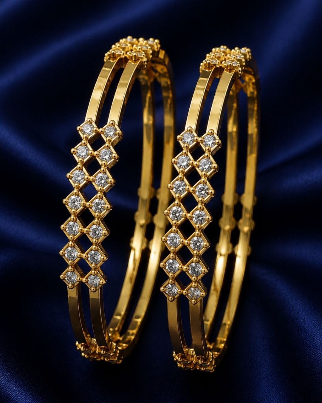Traditional gold plated bangle and jhumka earrings set featuring CZ stones, green gemstones, pink accents, pearl hangings, and a luxurious velvet presentation for festive occasions.