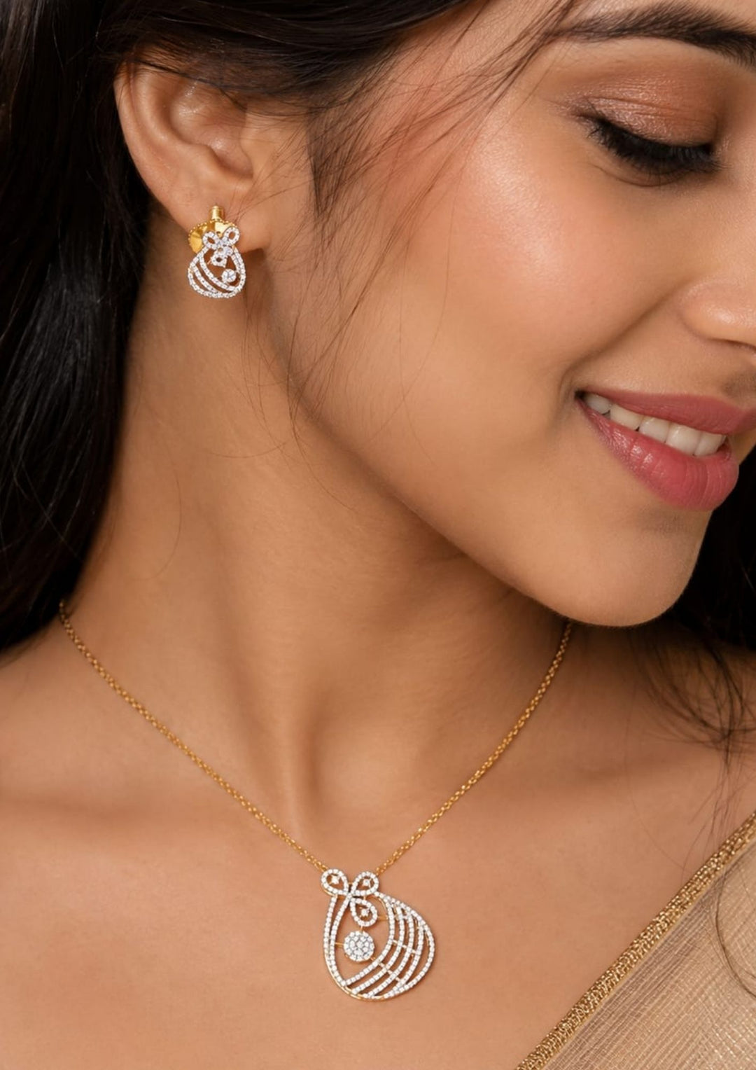 Close-up of a South Indian woman wearing Zircon diamond gold plated pendant with matching earrings featuring a sparkling floral bow-inspired design. with brilliant crystal detailing and matching stud earrings.Perfect for daily wear, gifting and special occasions.