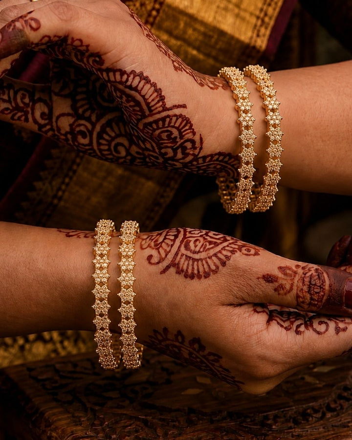 Beautiful gold plated zircon diamond bangle set with intricate floral stonework, perfect for weddings, festive occasions, traditional wear, and gifting.